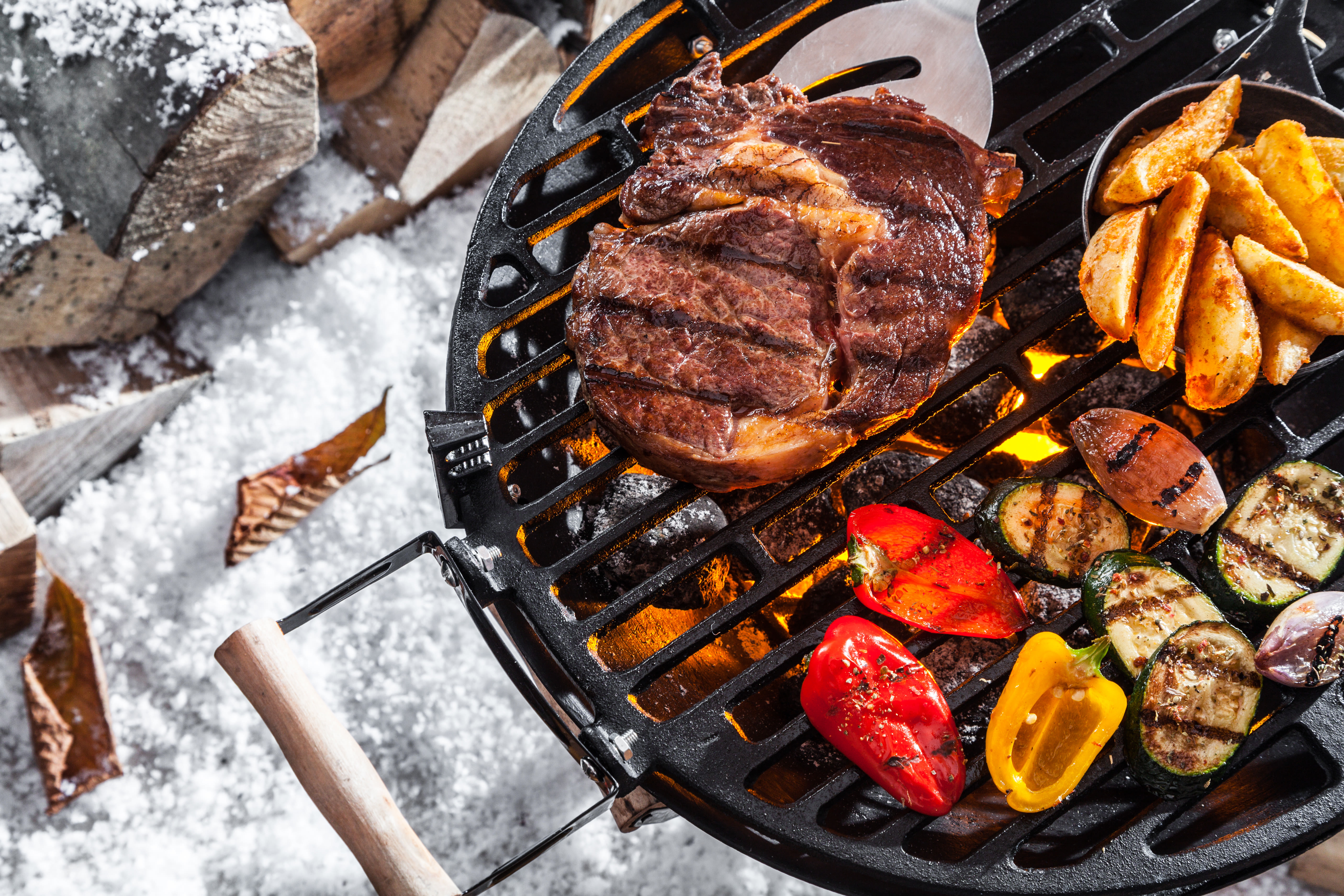 Tijdens de wintermaanden kun je ook barbecueën. Foto: Adobe Stock / exclusive-design