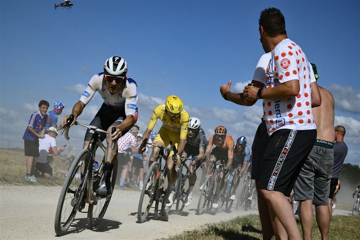 Remco Evenepoel en Tadej Pogacar in de etappe van 7 juli 2024. Via ANP Marco BERTORELLO / AFP